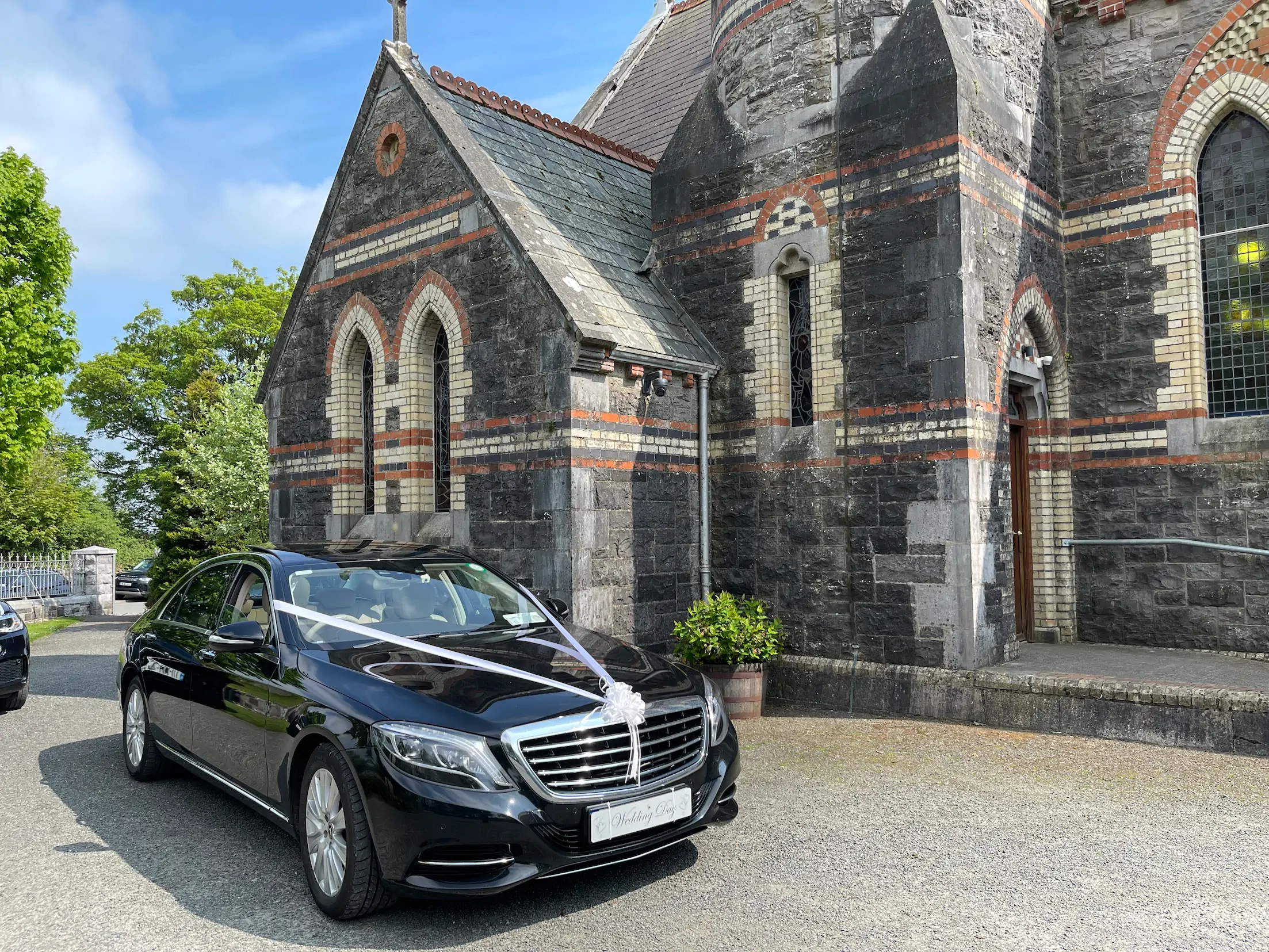 Elegant black Mercedes S-Class decorated for wedding